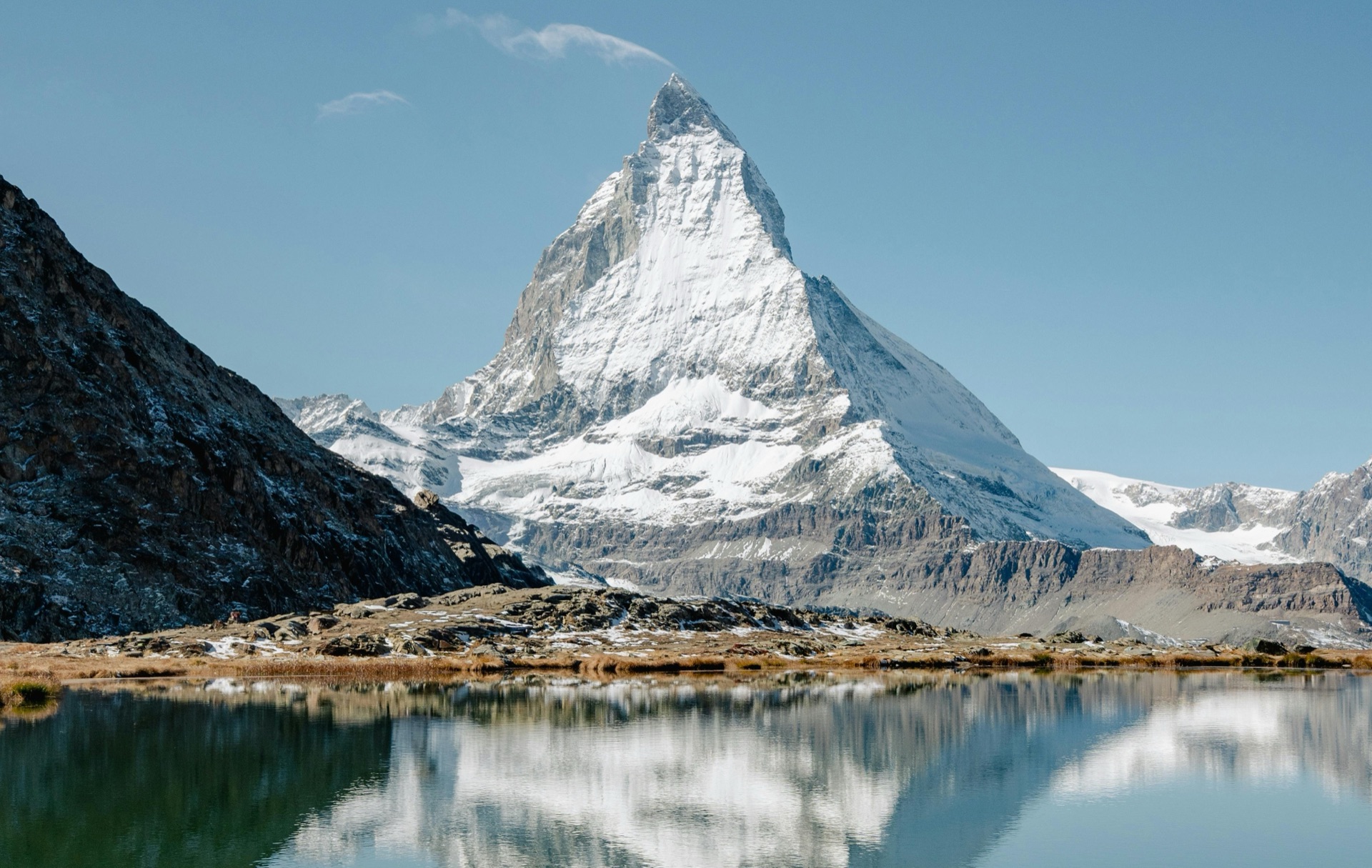 Matterhorn peak with traditional alpine chalet, European Alps